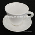 white cheap porcelain coffee cup and saucer after dinner